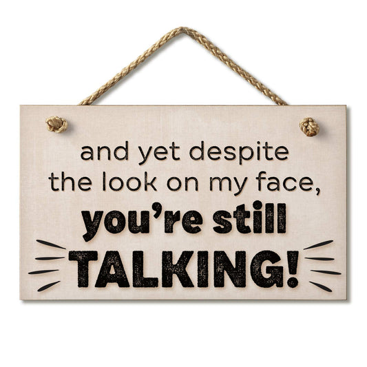 CounterArt "Despite The Look On My Face You're Still Talking" Decorative Hanging Wood Wall Sign 9.5” x 5.75” Made in the USA Features Braided Rope Hanger